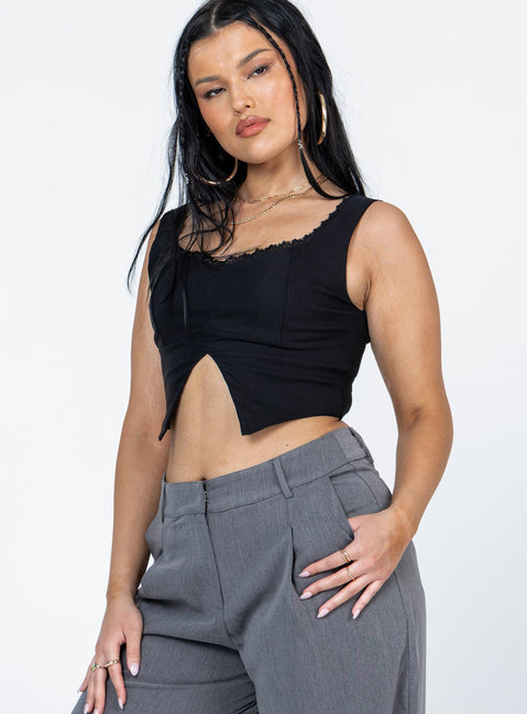 side view of model wearing Princess Polly Auburn Top Black Sleeveless Scoop Neck 