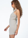 side view of model wearing Princess Polly Ellie Mini Dress Beige High Neck 