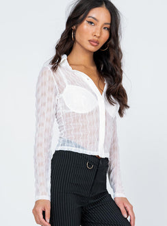 side view of model wearing Princess Polly Seren Long Sleeve Top White 