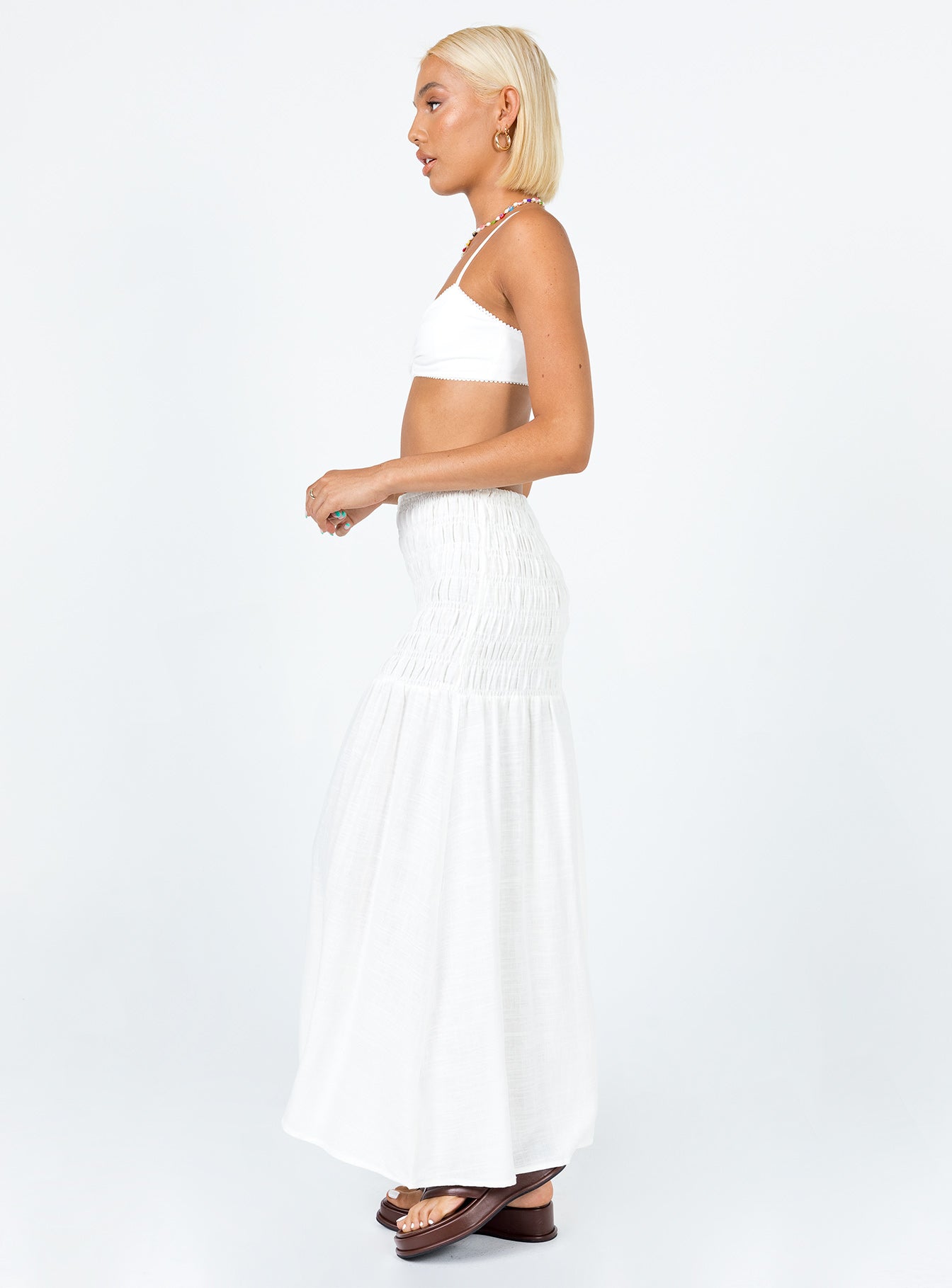   side view of model wearing Princess Polly Porto Maxi Skirt White Maxi 