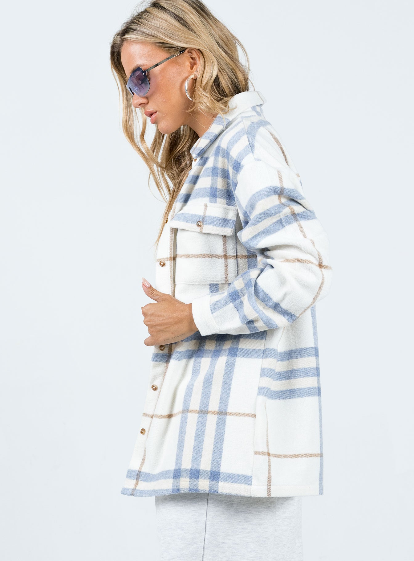 Oversized shirt Soft flannelette material Plaid print Button front fastening Twin chest pockets Single button cuff