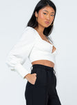 side view of model wearing Princess Polly Dimitri Long Sleeve Top White 