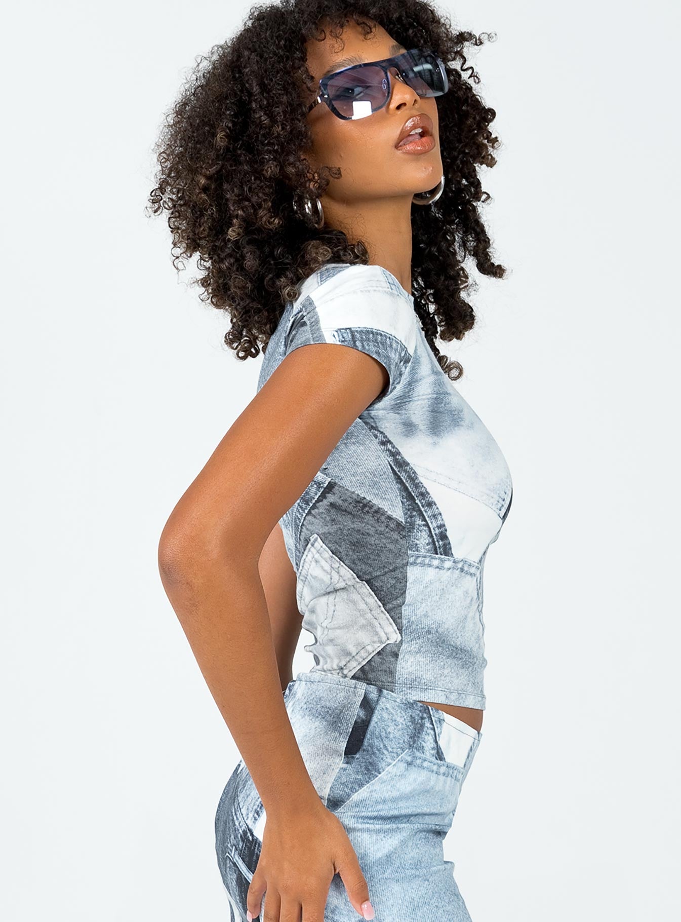 side view of model wearing Princess Polly Motel Tiona Top Denim Pocket Blue Short Sleeves High Neck 