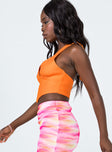 side view of model wearing Princess Polly Dreaming Top Orange 