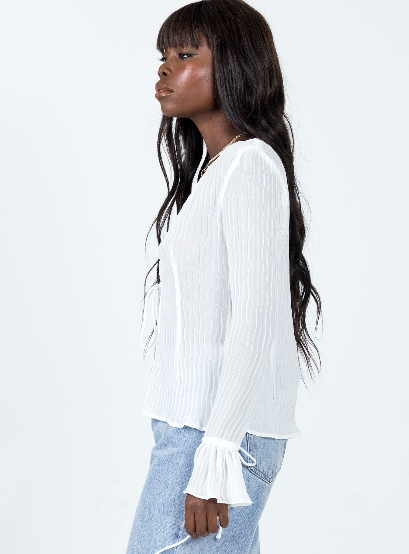 side view of model wearing Princess Polly Brody Long Sleeve Top White 