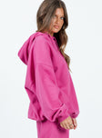 side view of model wearing Princess Polly Ritu Oversized Hoodie Pink Long 