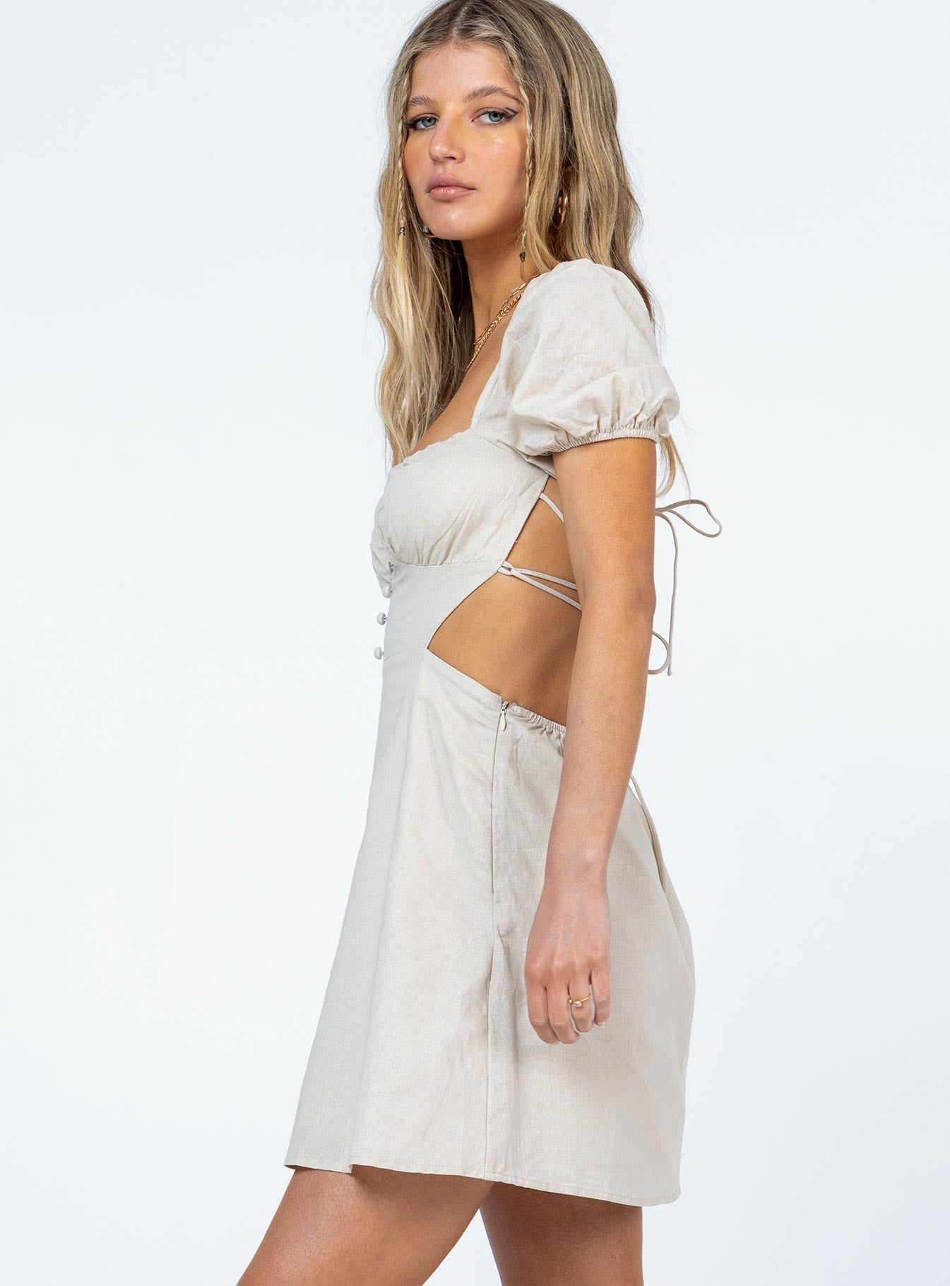 side view of model wearing Princess Polly St. Louis Mini Dress Beige 