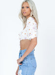 side view of model wearing Princess Polly Caribou Top White Floral Half Sleeves Square Neck 