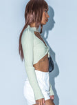 side view of model wearing Princess Polly Iris Long Sleeve Top Green 