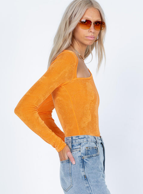side view of model wearing Princess Polly Maira Long Sleeve Bodysuit Orange Full Sleeves Asymmetric Neckline 