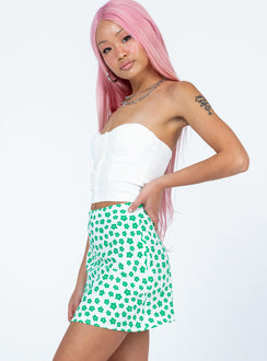   side view of model wearing Princess Polly Corat Mini Skirt Green Mini Skirts 