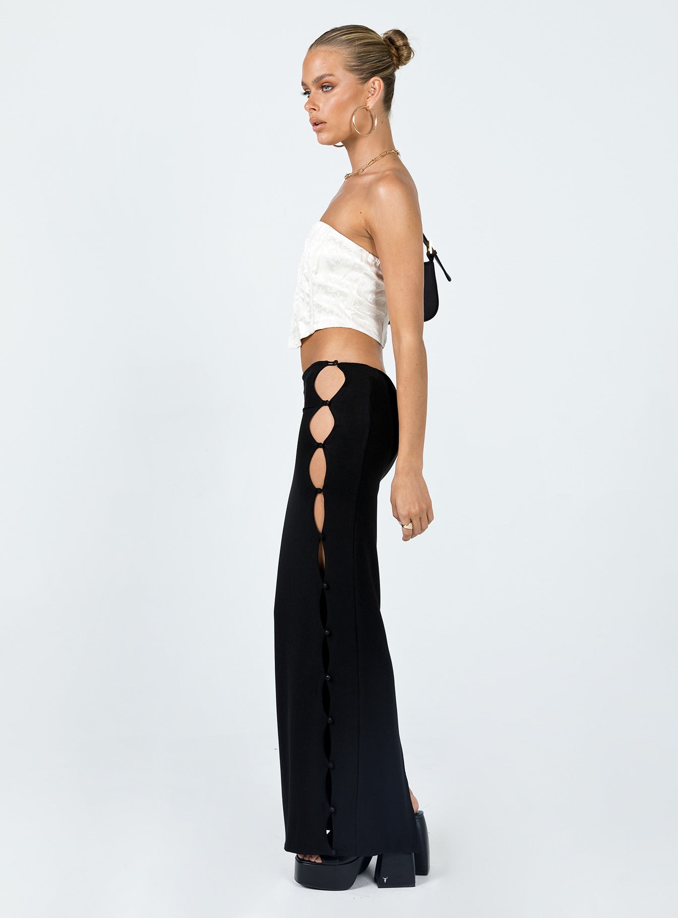   side view of model wearing Princess Polly Jordan Knit Midi Skirt Black 