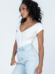 side view of model wearing Princess Polly Wayne Bodysuit White Short Sleeves V-Neck 