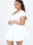 side view of model wearing Princess Polly Daniela Mini Dress White Curve Sweetheart Neckline 