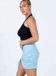   side view of model wearing Princess Polly Avani Mini Skirt Blue 