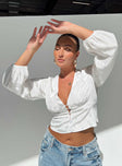 front view of model wearing Princess Polly Traylen Long Sleeve Top White Full Sleeves Plunger 