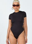 front view of model wearing Princess Polly Riverstone Bodysuit Black Short Sleeves High Neck 