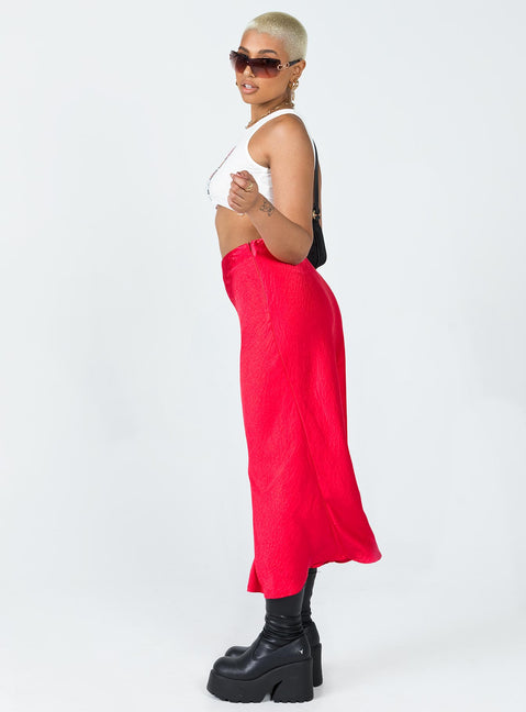   side view of model wearing Princess Polly Tyra Satin Midi Skirt Red Midi Skirts 