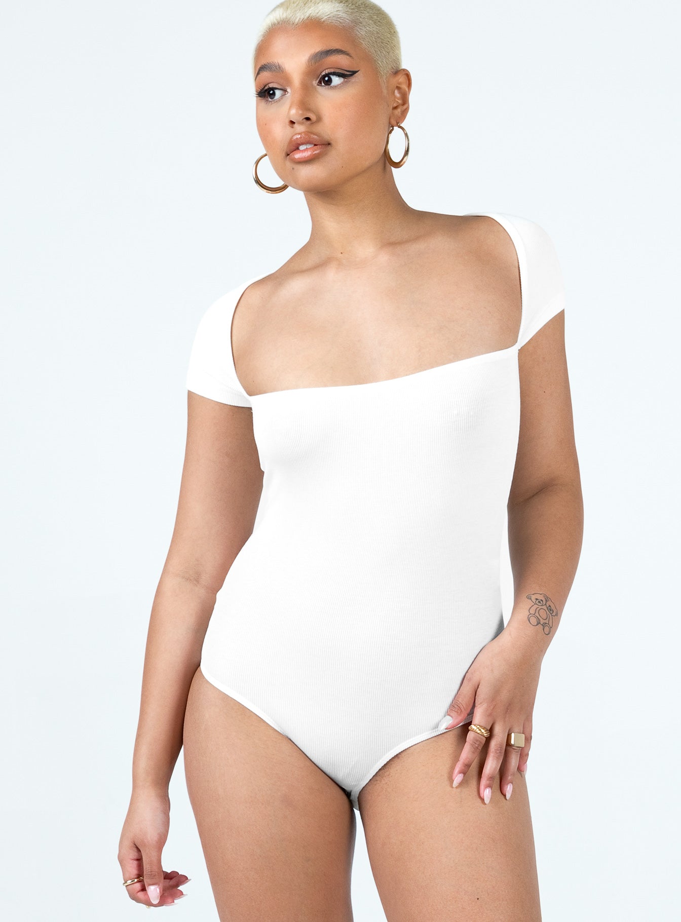 side view of model wearing Princess Polly Langley Bodysuit White Short Sleeves Square Neck 
