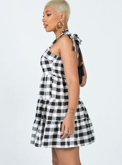side view of model wearing Princess Polly Rae Mini Dress Black / White 