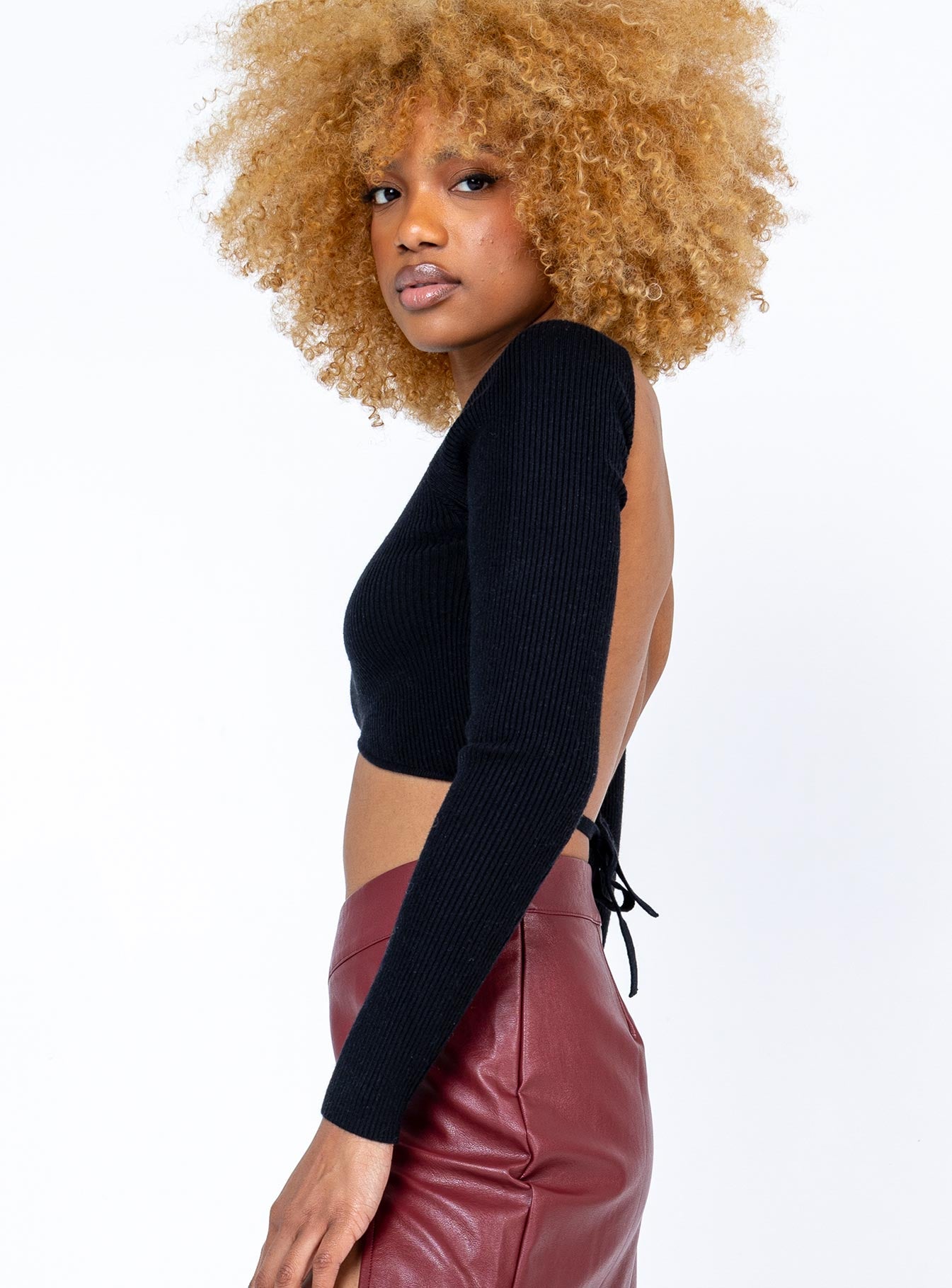 side view of model wearing Princess Polly Cyrus Long Sleeve Top Black 