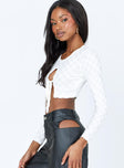 side view of model wearing Princess Polly Jeremiah Long Sleeve Top White 