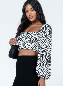 side view of model wearing Princess Polly Ariah Long Sleeve Top Zebra Full Sleeves Square Neck 