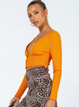 side view of model wearing Princess Polly Angelo Long Sleeve Top Orange 