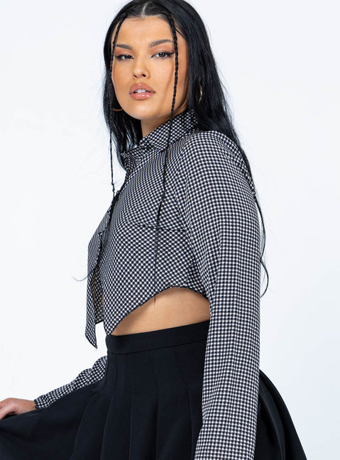 side view of model wearing Princess Polly Nina Long Sleeve Top Black 