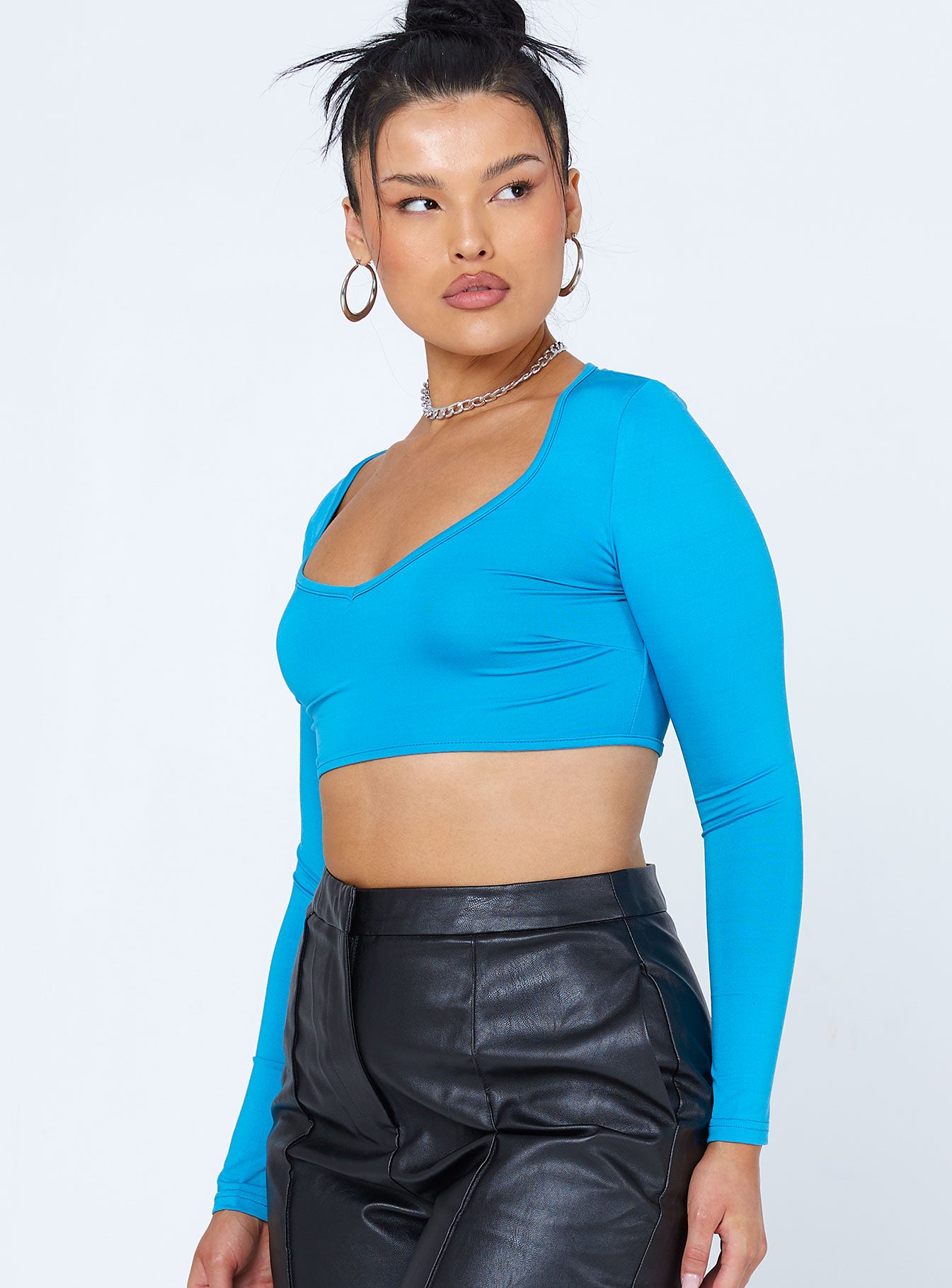 side view of model wearing Princess Polly Ryder Long Sleeve Top Blue 