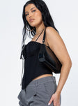 side view of model wearing Princess Polly Del Gato Corset Top Black Sleeveless 