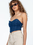 Bustier top Dark wash denim  Sweetheart neckline Pointed hem  Zip fastening at back 