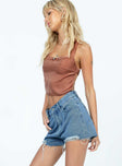 Denim shorts Mid wash denim High waisted Belt looped waist Classic five-pocket design Distressed detailing Raw-edge hem