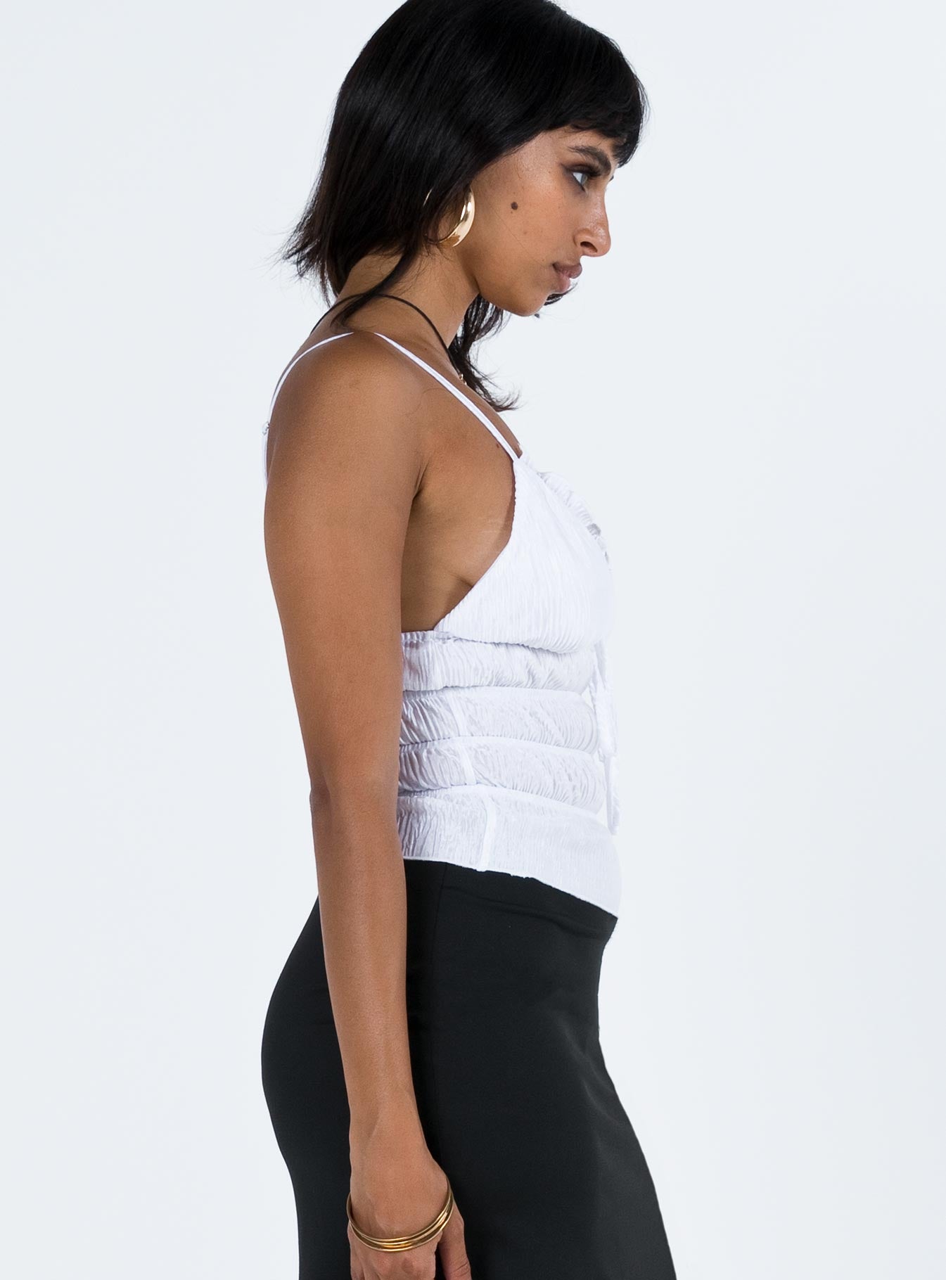 Front view of model wearing  front Princess Polly Sleeveless Asymmetric Neckline  Masey Top Ivory