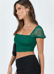 side view of model wearing Princess Polly City Lights Crop Top Green Short Sleeves Square Neck 