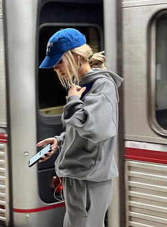 back view of model wearing Princess Polly Ritu Oversized Hooded Charcoal Cropped 