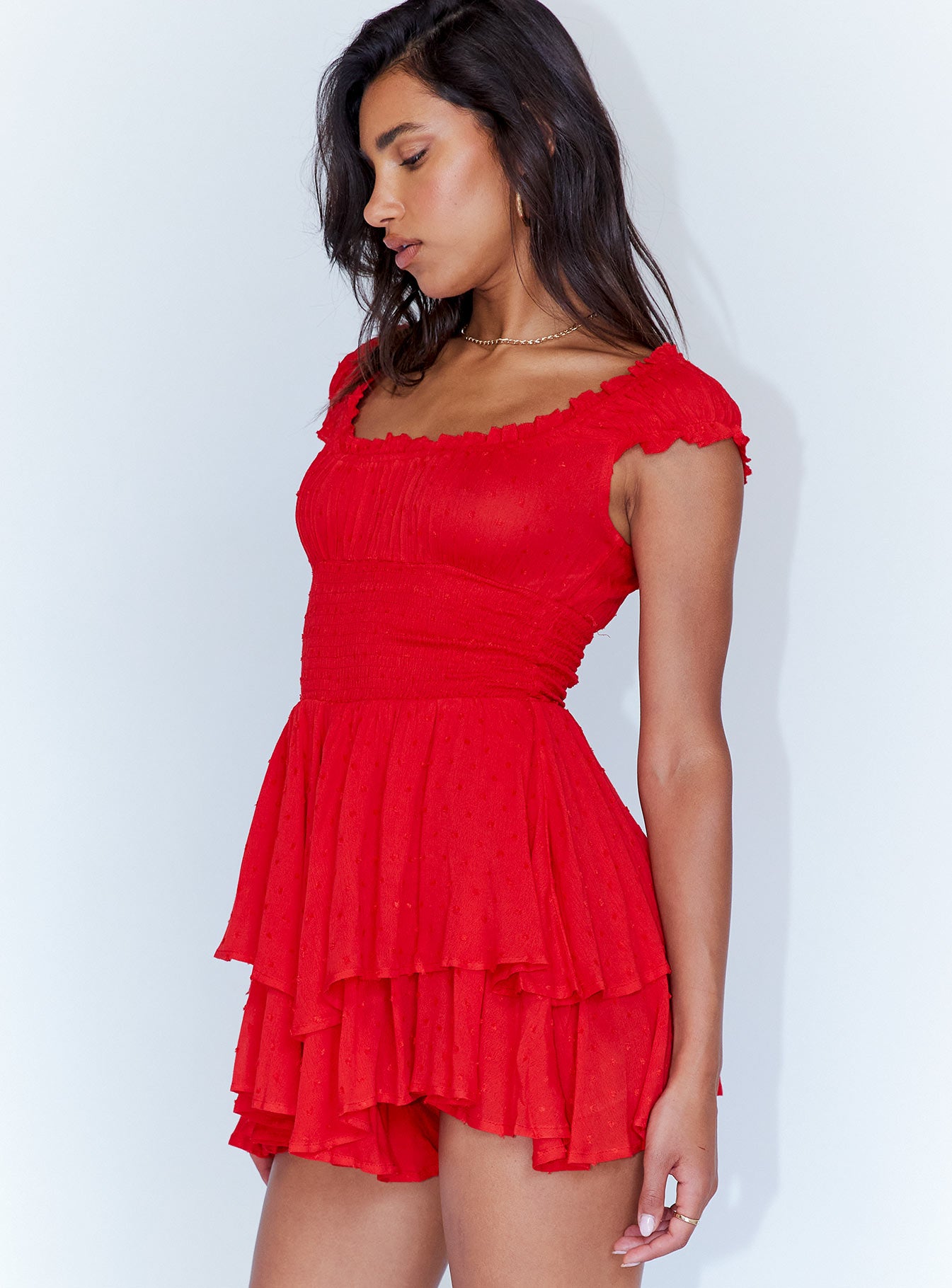 Romper Soft textured material Shirred waistband Ruffle detailing Elasticated neck and sleeves Good stretch   Fully lined