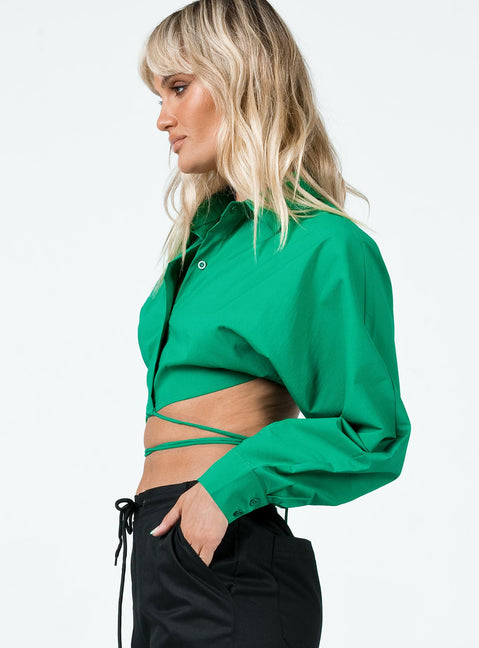 side view of model wearing Princess Polly Rylen Long Sleeve Top Green 