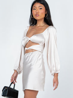 side view of model wearing Princess Polly Nakita Long Sleeve Mini Dress Champagne 