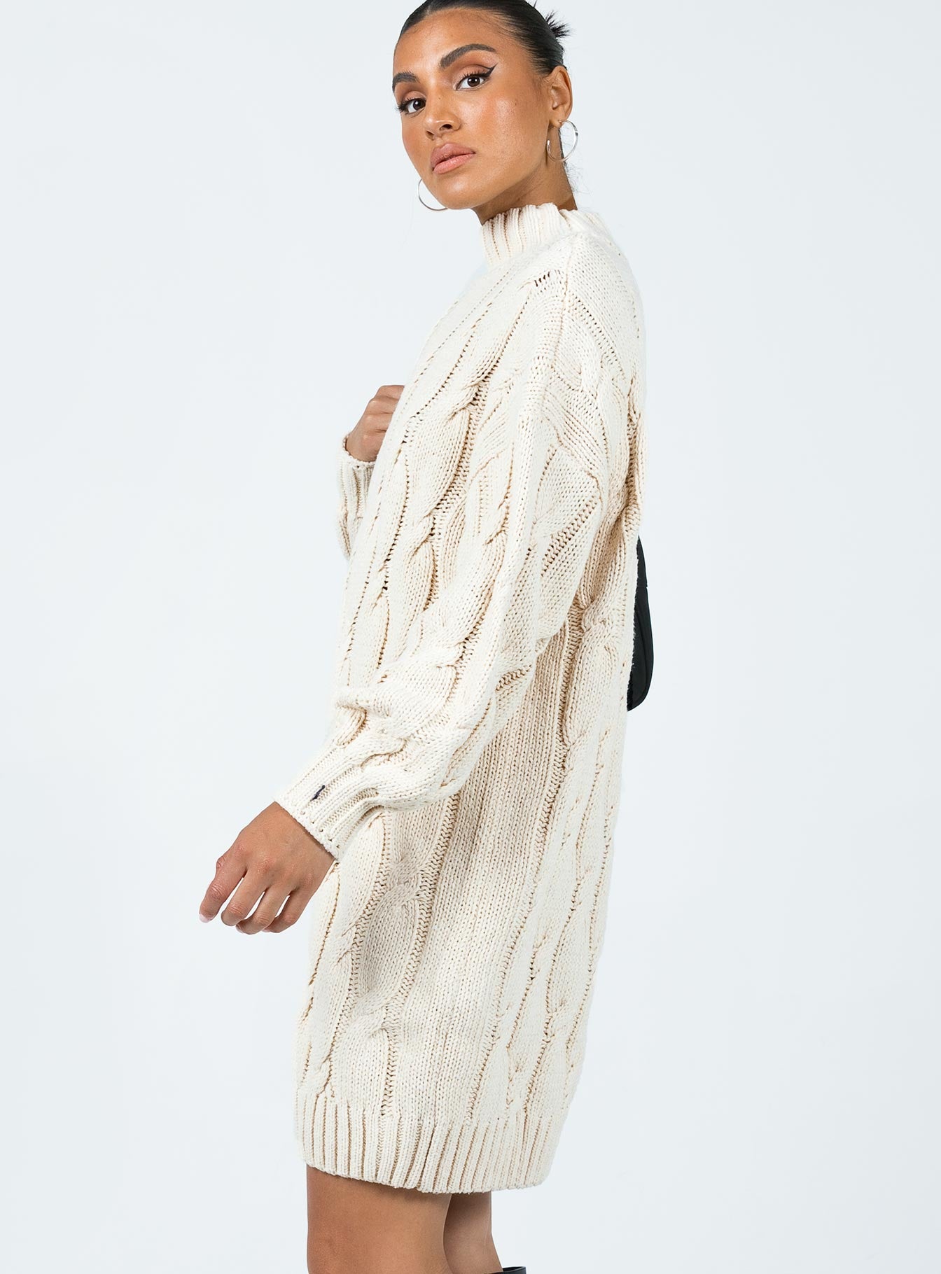 Front view of model wearing  front Princess Polly High Neck  Corthay Sweater Mini Dress Cream