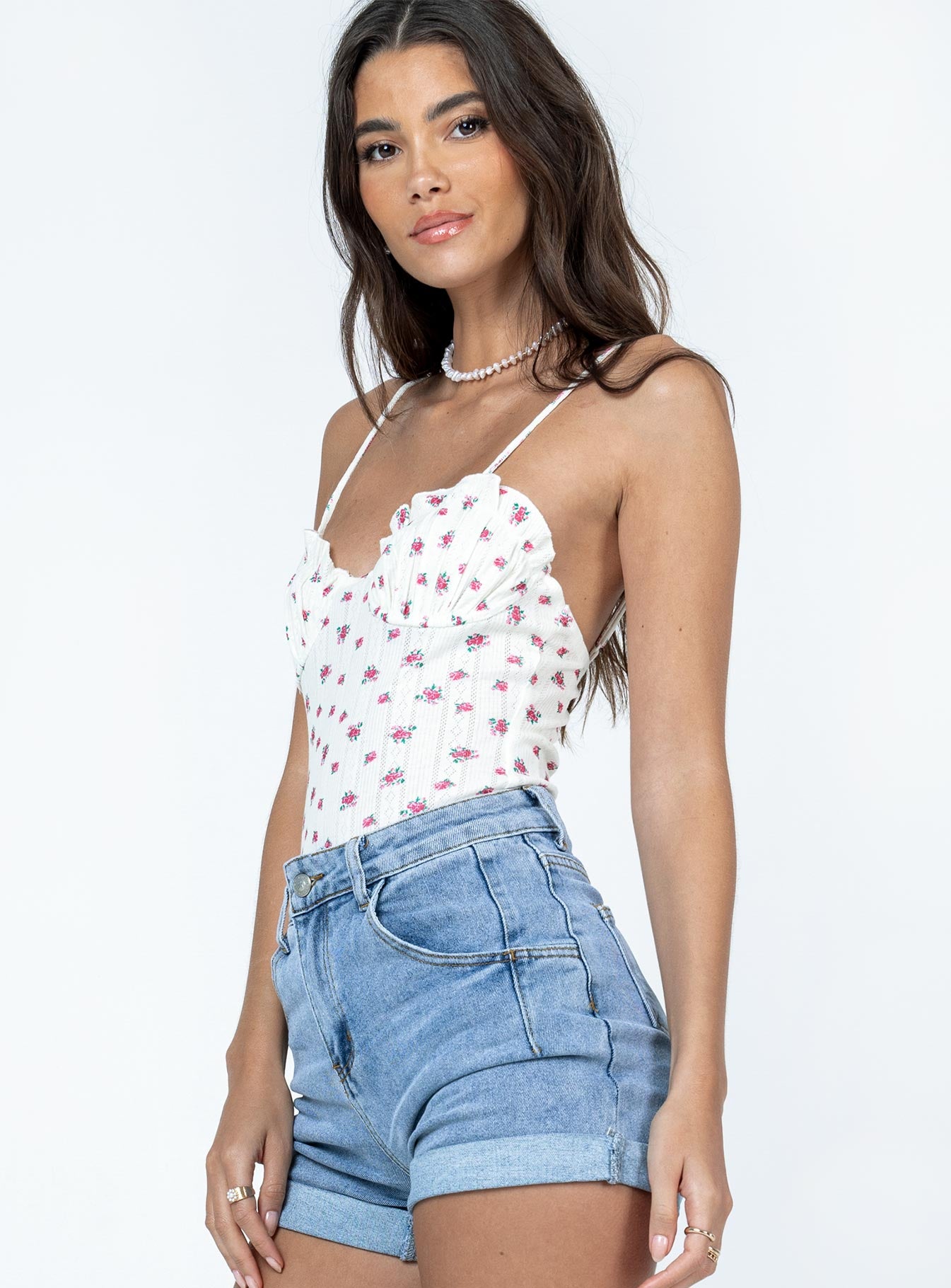 side view of model wearing Princess Polly Florel Pointelle Bodysuit White Sleeveless Sweetheart 