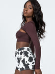 side view of model wearing Princess Polly Kelly Long Sleeve Top Brown 