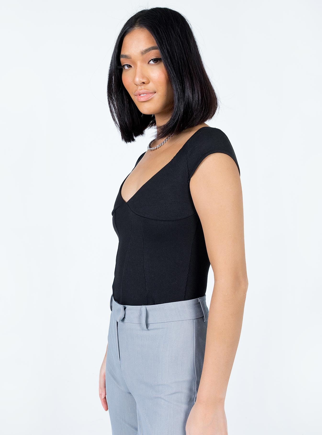side view of model wearing Princess Polly Alden Bodysuit Black Short Sleeves V-Neck 