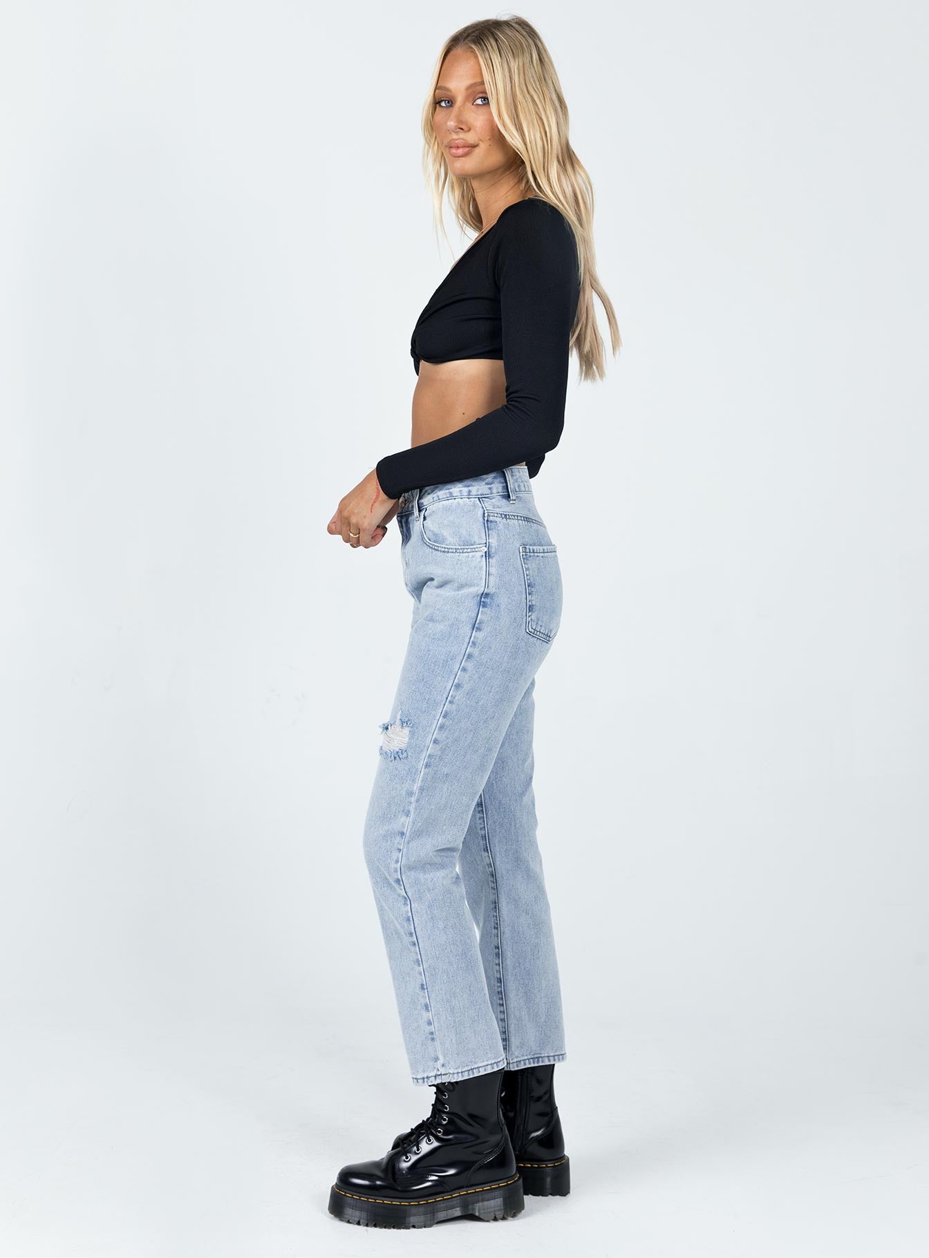 side view of model wearing Princess Polly Valencia Denim Jeans Mid Rise 