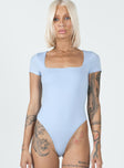 front view of model wearing Princess Polly Chavis Bodysuit Blue Short Sleeves Square Neck 