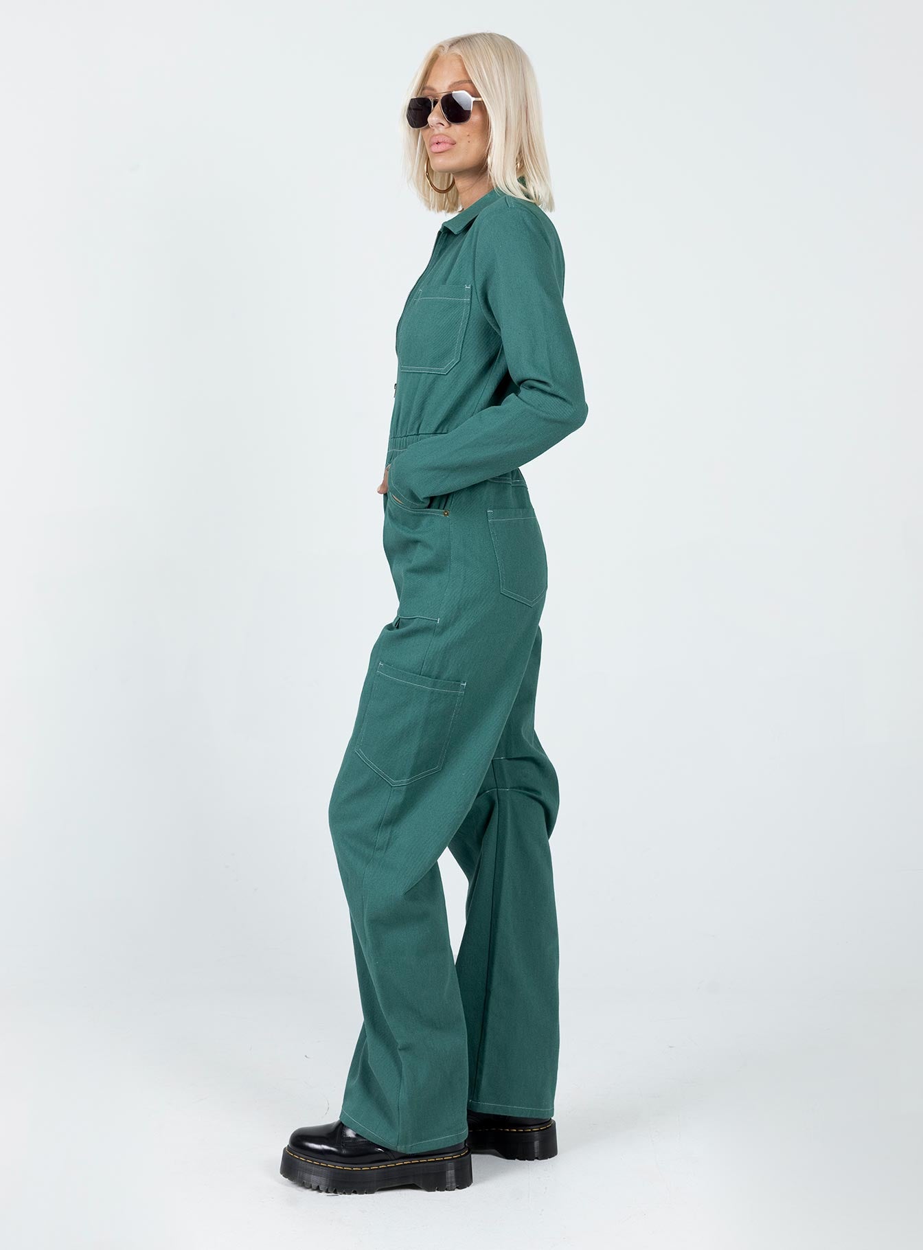 Boiler suit 100% cotton Relaxed fit Contrast stitching  Classic collar  Zip front fastening  Twin chest pockets  Six leg pockets  Elasticated waistband   Wide leg  Pleated detail at inner leg 