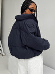 Puffer jacket High neck Zip front fastening Twin zip front pockets Ribbed cuffs Drawstring waist