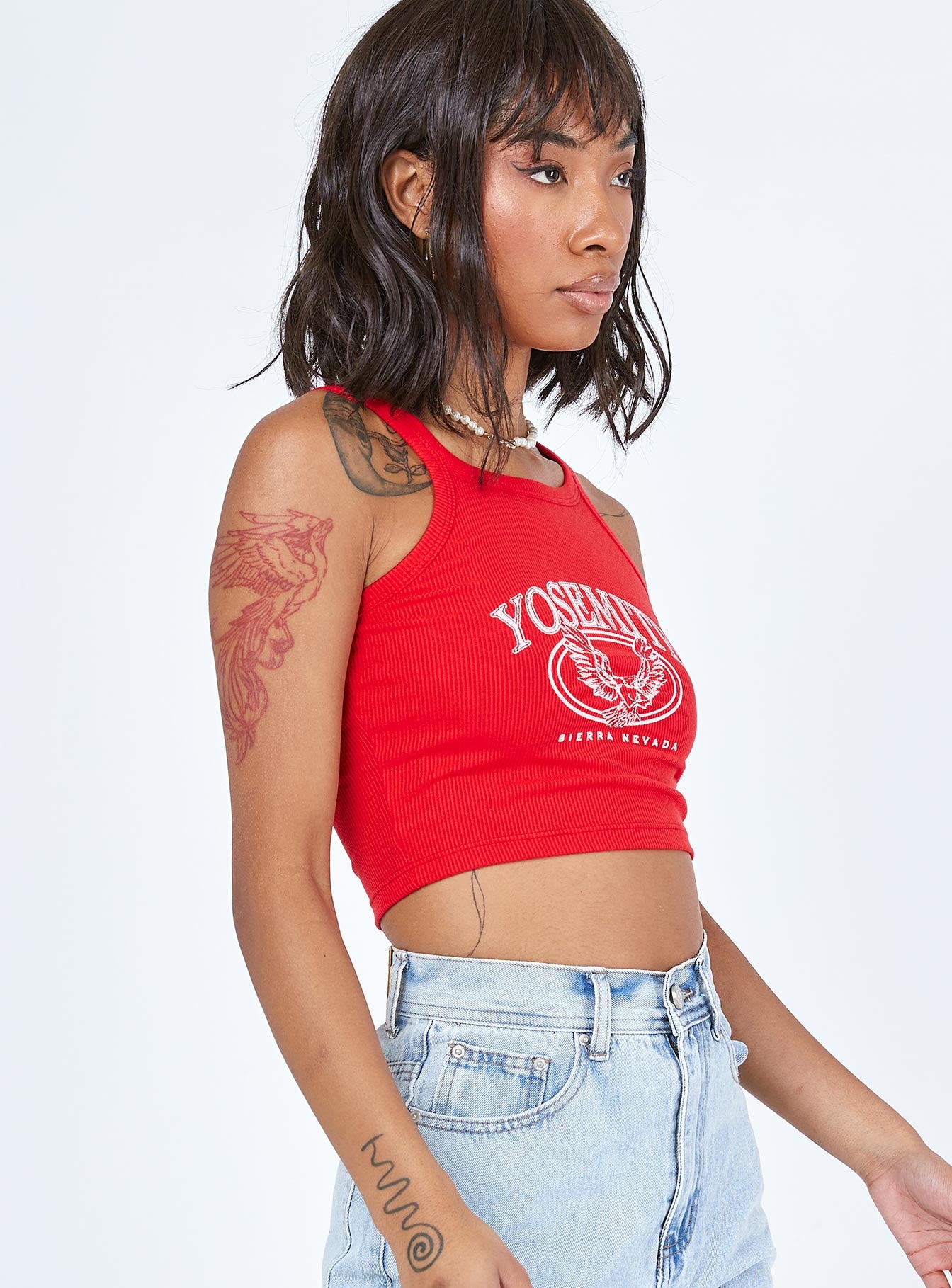 side view of model wearing Princess Polly Yosemite Tank Top Red 