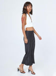   side view of model wearing Princess Polly Tyra Satin Midi Skirt Black 