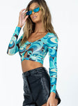 side view of model wearing Princess Polly Bestwick Long Sleeve Top Teal Floral Full Sleeves Scoop Neck 